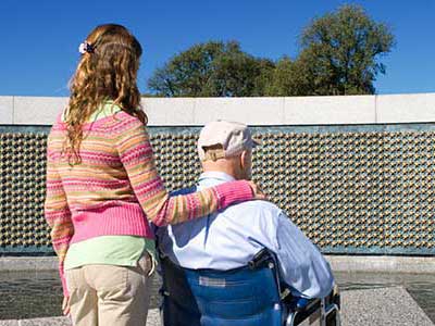 Father and daughter at war memorial